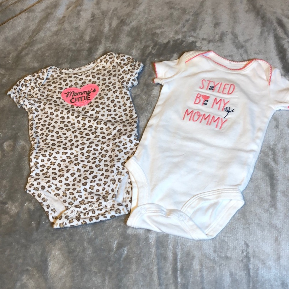 2 onsies like new. Leopard print 0-3 months and white with pink 3 months
